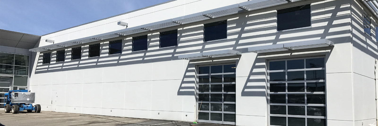 BOSSWASH pressure washer truck outside a warehouse