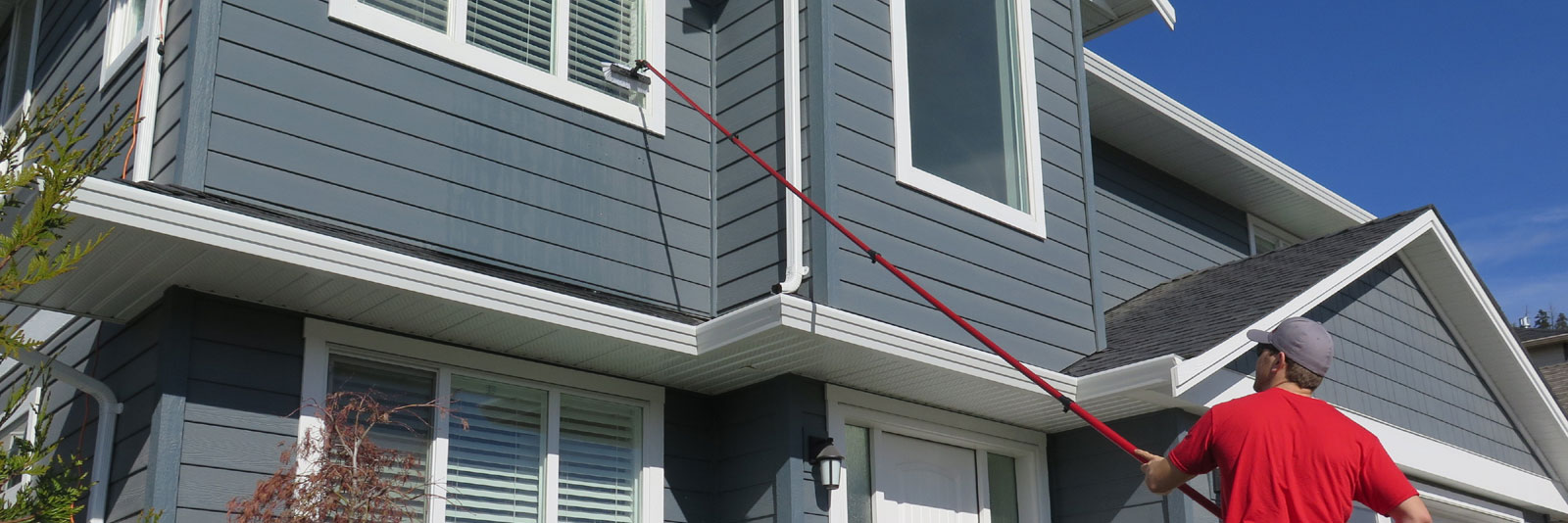 Washing house windows ground level